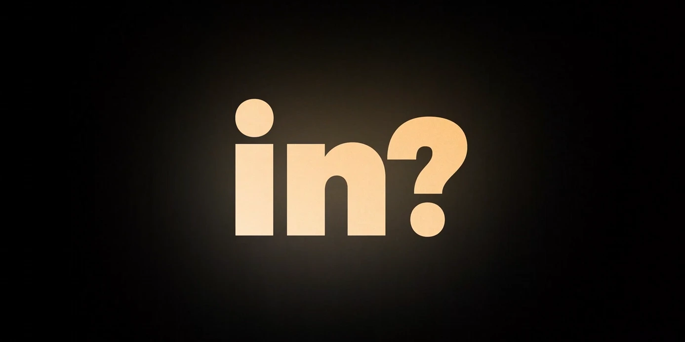 Black background with a glowing word: "in?"